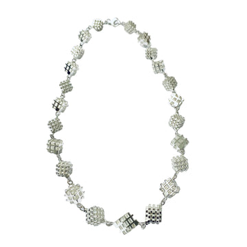 3D hashtag art necklace with positive negative space hashtag cubes in a repeat pattern necklace