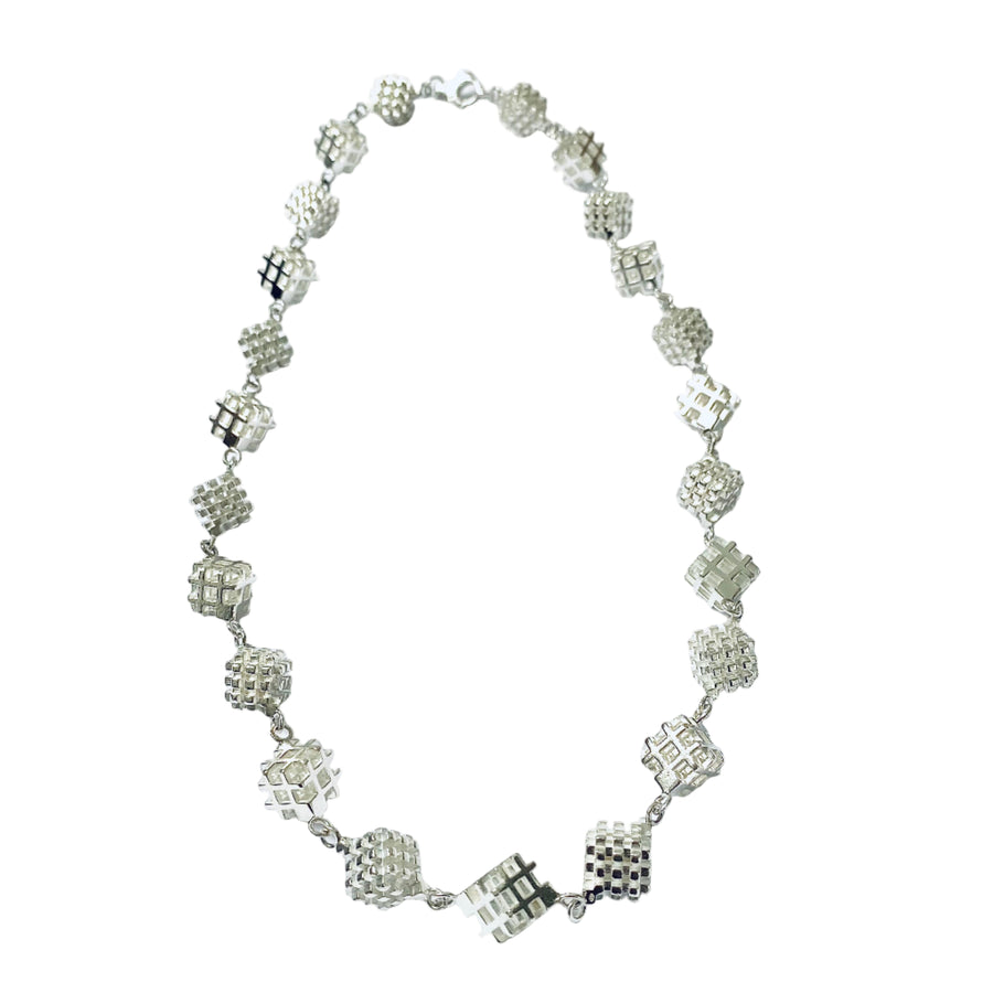 3D hashtag art necklace with positive negative space hashtag cubes in a repeat pattern necklace