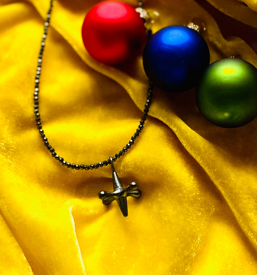 black jack with spinel chain on yellow velvet