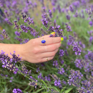 gold and lapis lazuli ring in summer time