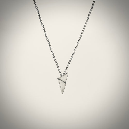 Sterling silver clash pendant suspended on silver belcher chain handmade in Ireland