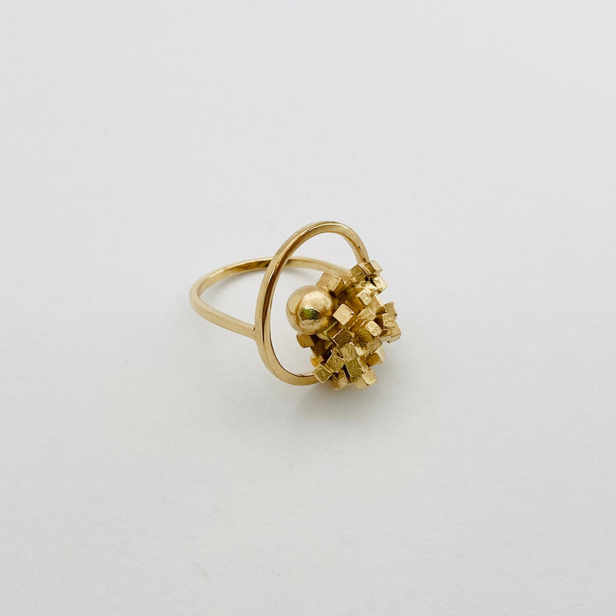 gold demi cluster ring framing cluster with sphere bursting out