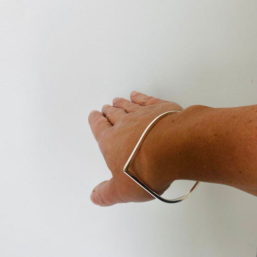 modern square teardrop bangle handmade in Ireland from sterling silver.