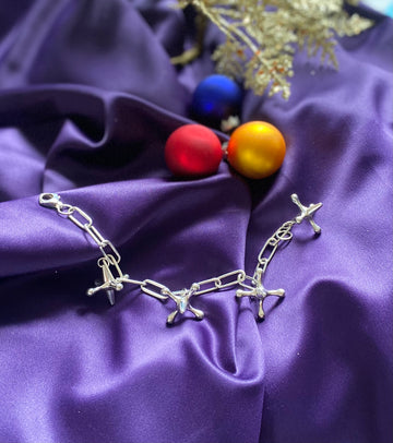 silver charm bracelet featuring the toy jacks from our childhood 