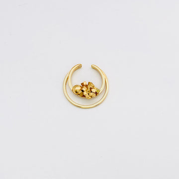 Contemporary Design Ear cuff featuring a double circular frame and cluster of metal with emanating sphere. Handmade in gold for an ultra modern look.